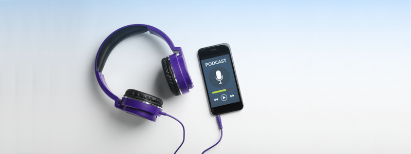 Purple headphones connected to a smartphone displaying a podcast app on a gradient blue background.